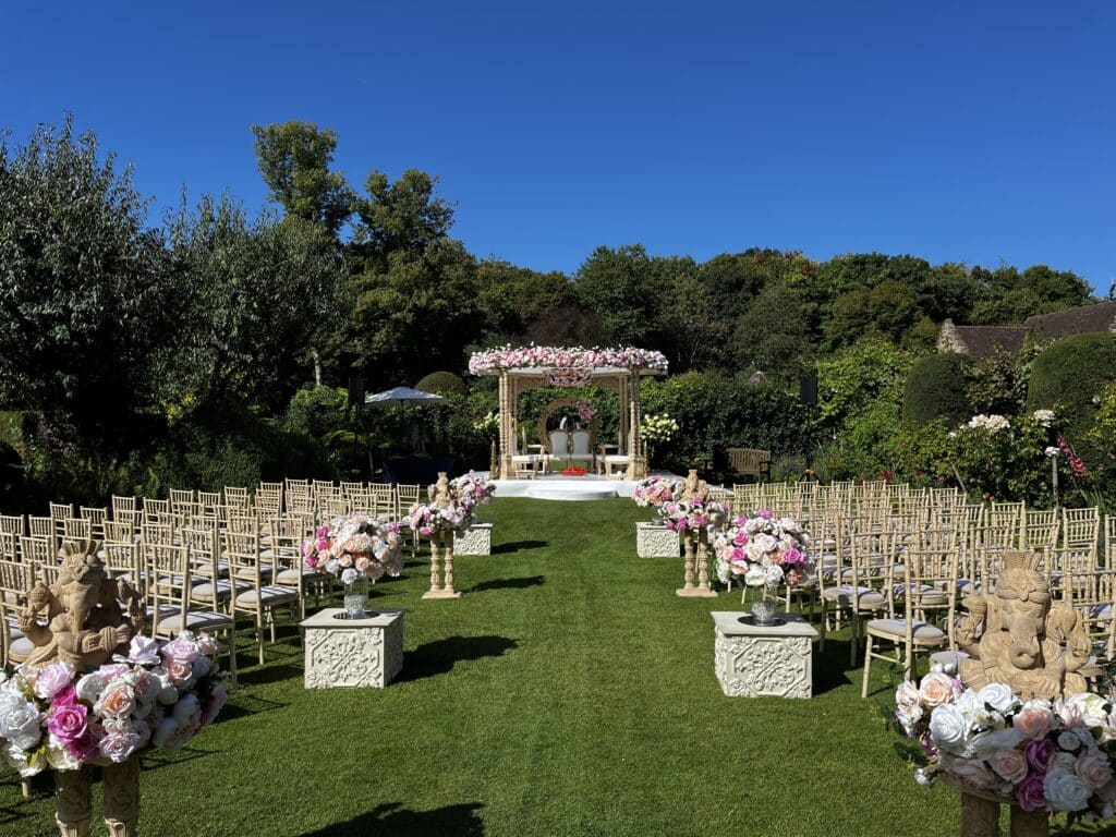 Chenies Manor House outdoor pergola set out for wedding ceremony