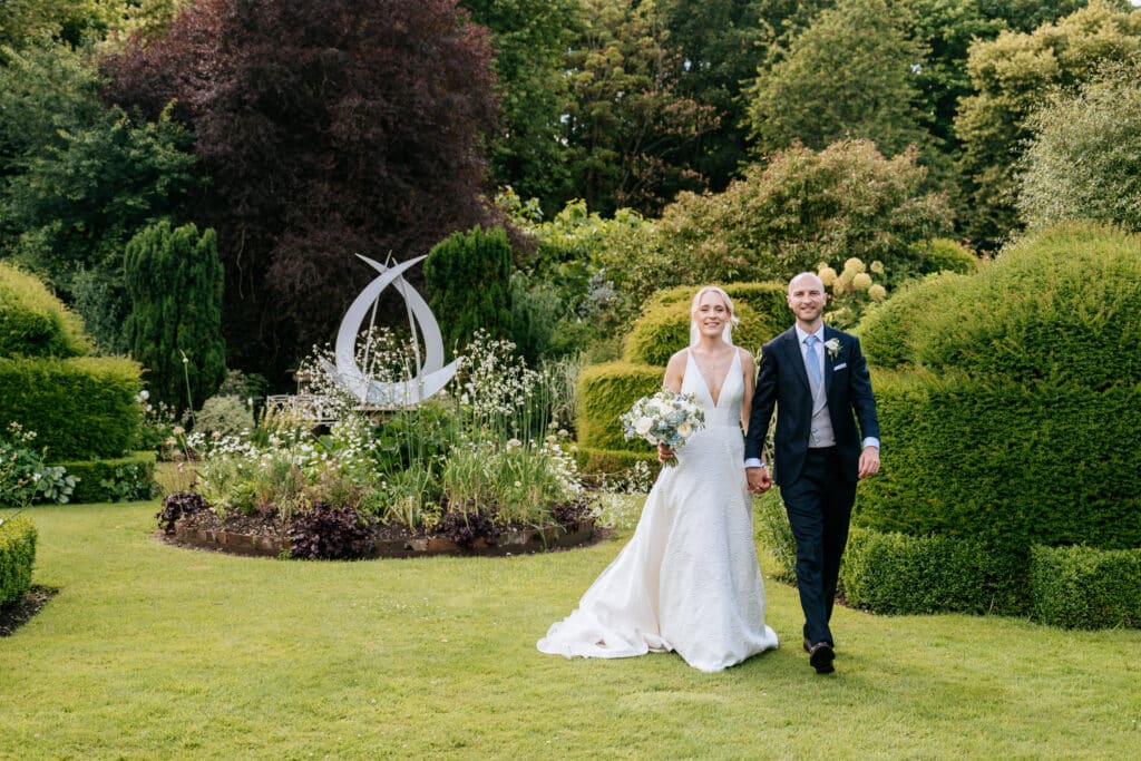 Chenies Manor House bride & groom in the garden