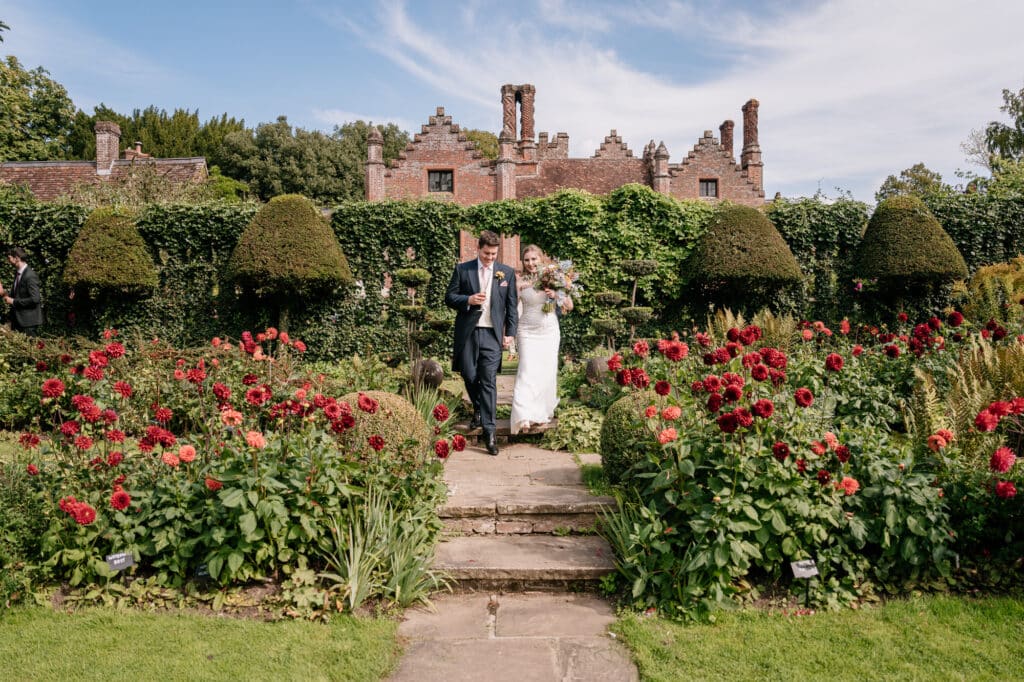 Chenies Manor House bride and groom in the garden